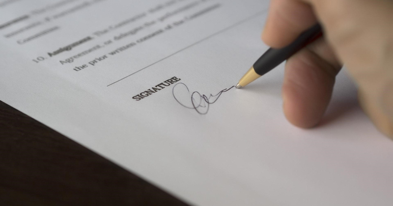 Signing a contract for SEO services.